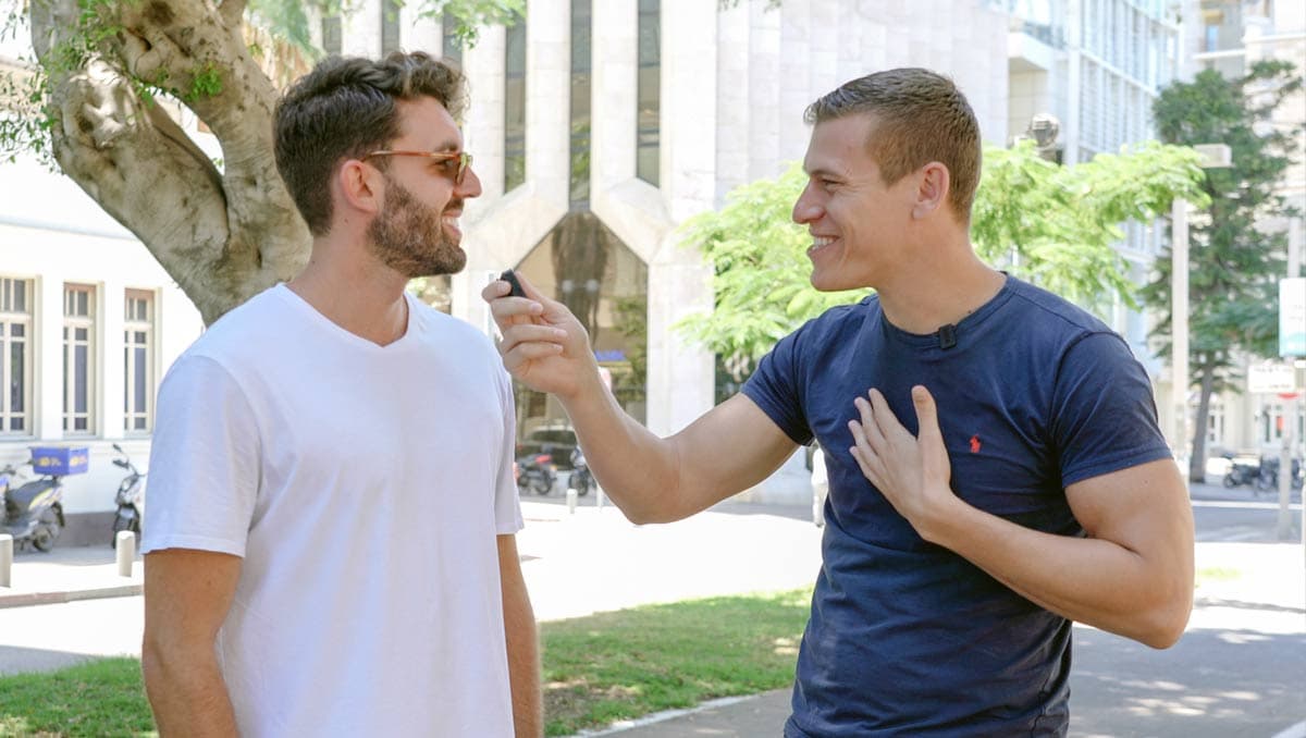 Elisha Lazarus (right) interviewing an Israeli in Tel Aviv for SO BE IT!