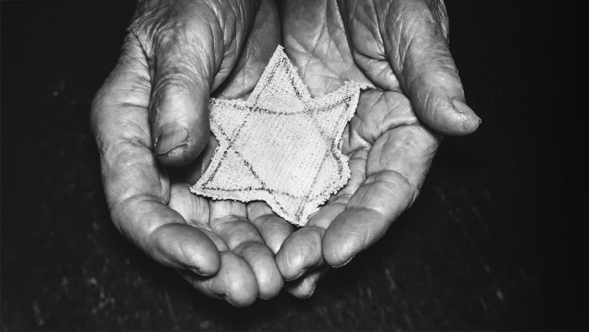 Hands holding Star of David