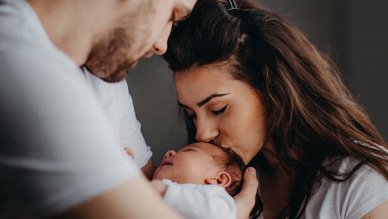 father, mother and baby