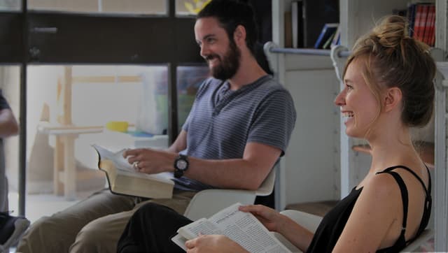 Young people studying the Bible.