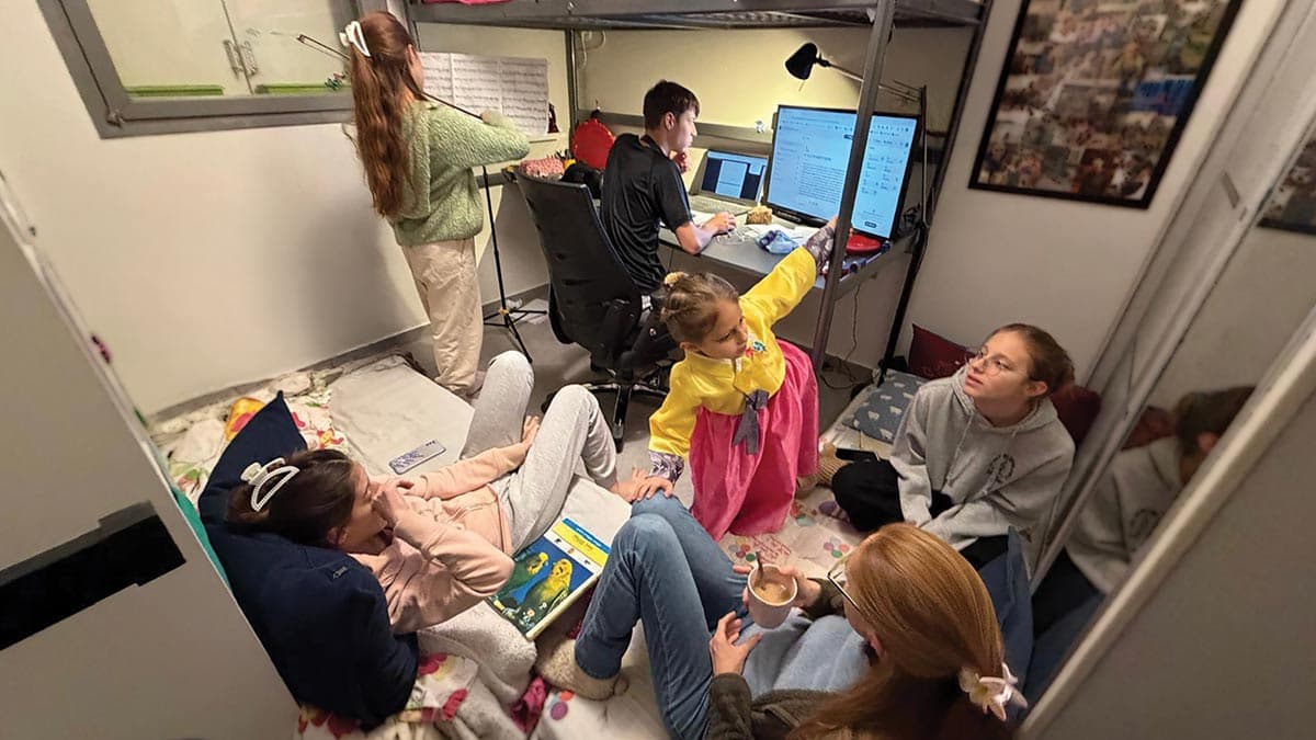 Family gather in their bomb shelter in Israel