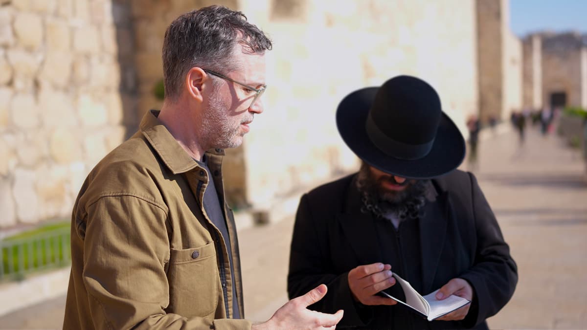 Messianic jewish man talking with orthodox jewish man about the new testament