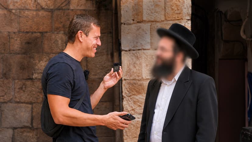Elisha from SO BE IT, interviewing with a Haredi man in the streets of Jerusalem