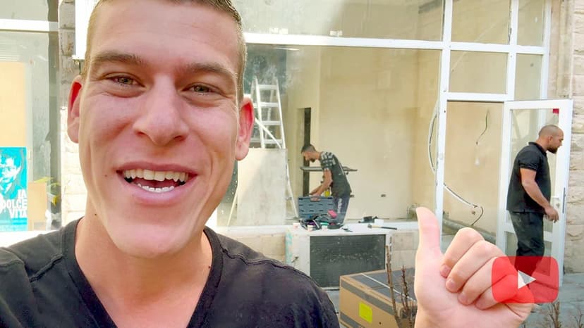 Staff member on street in front of new ministry space under construction