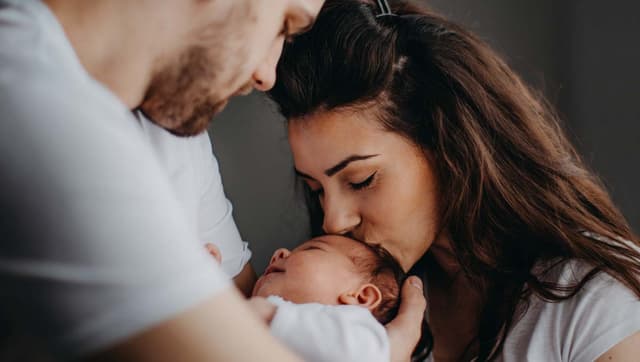 father, mother and baby