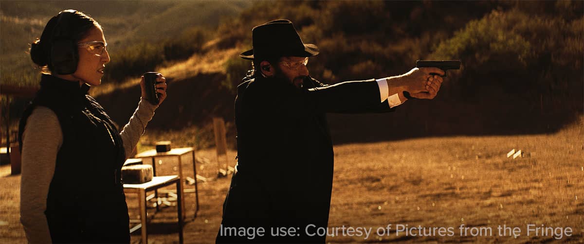 Man and woman on shooting range — Image use: Courtesy of Pictures from the Fringe