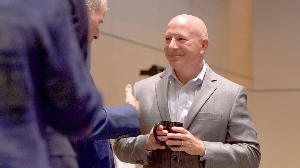 Attendees in discussion during the event