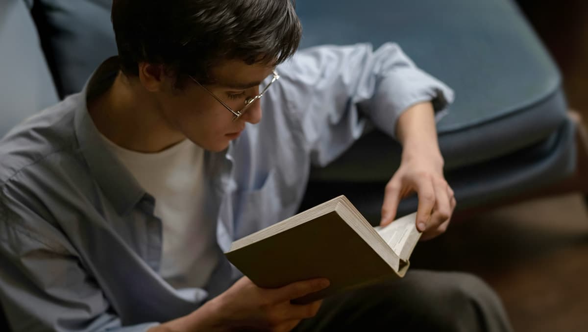 Young man reading a book
