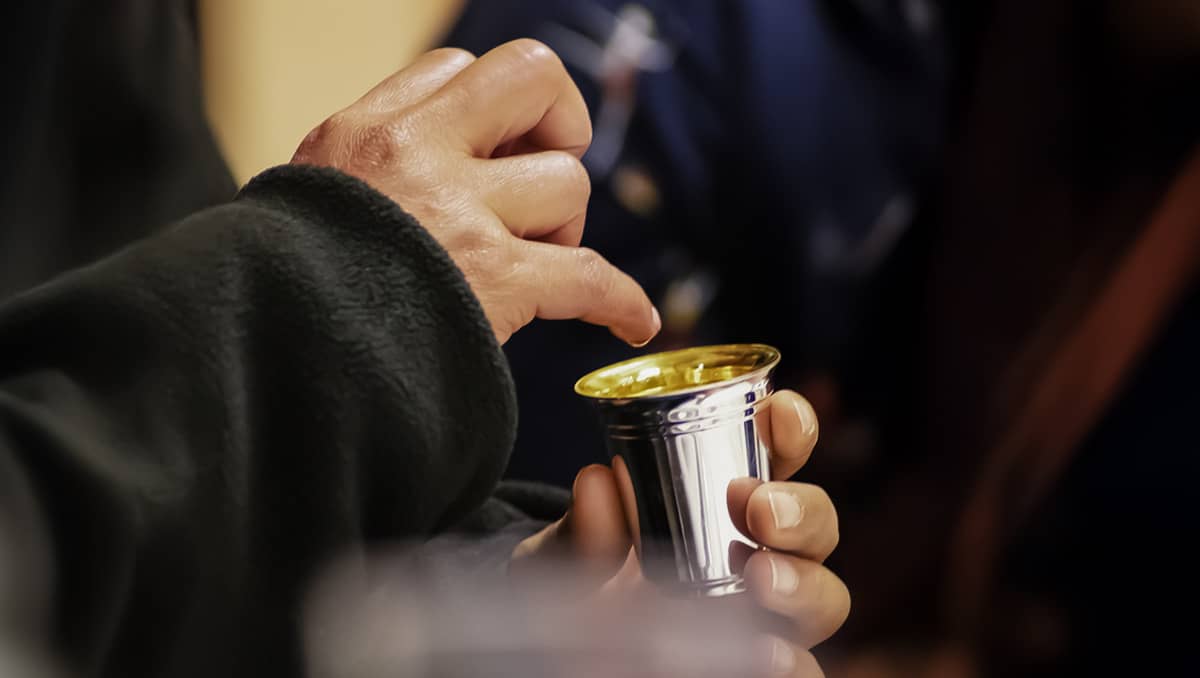 Hand on cup-Passover