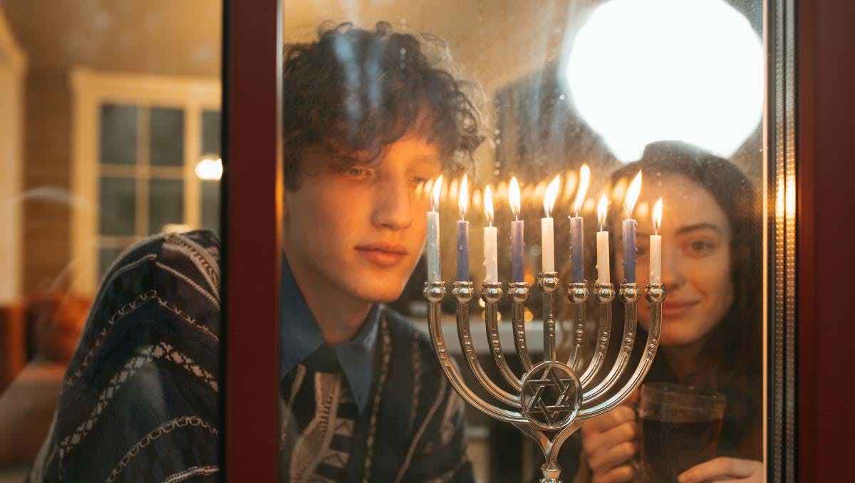 Interfaith couple celebrating Hanukkah