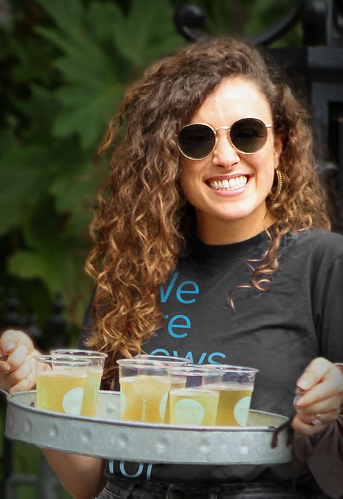 Smiling woman offering cold drinks