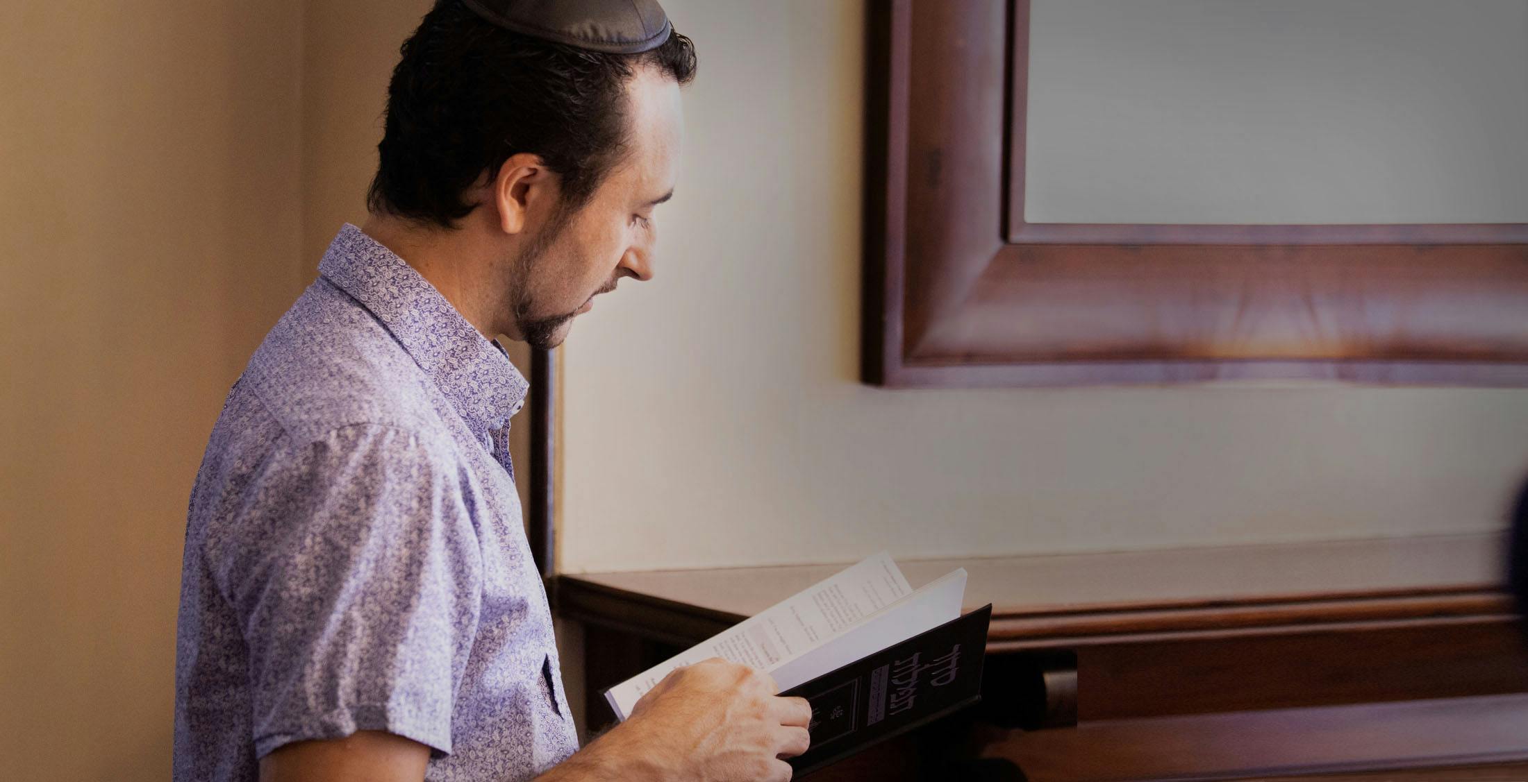 Messianic Jewish man reading the Torah
