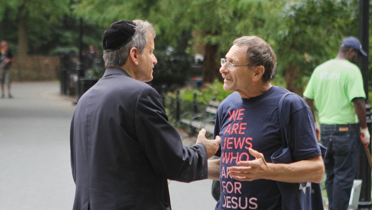 Jews for Jesus staff talking with another Jewish man