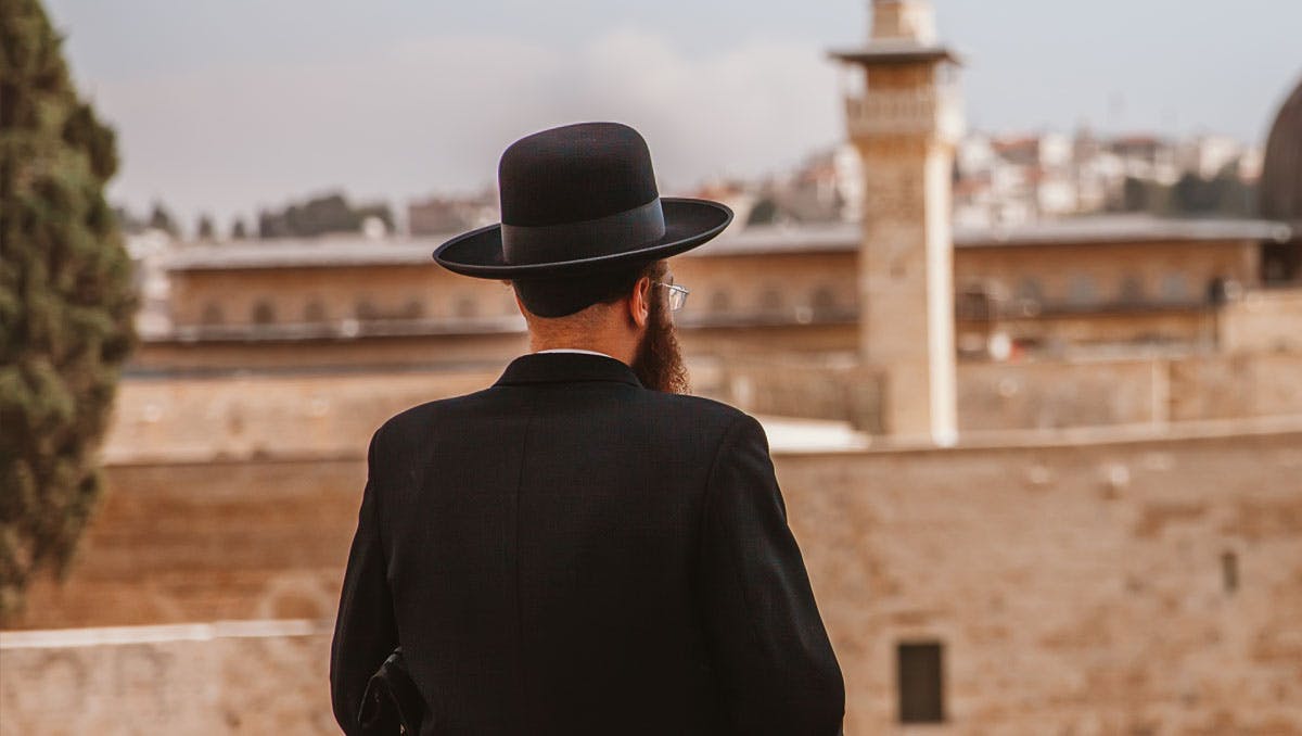 Orthodox Jewish man looking at Jerusalem.